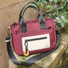 Bolso de mano con bandolera, color burdeos, Serie core. 27x20x10 cm
